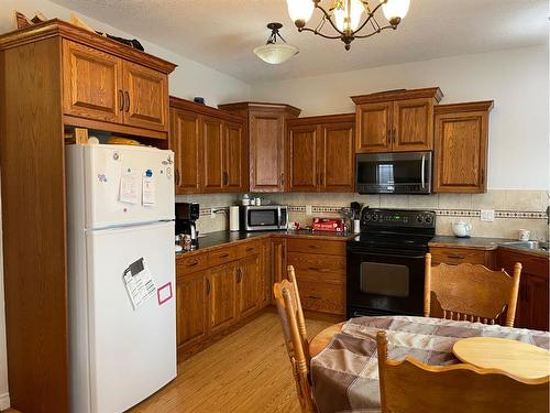 226 Harvest Hills Boulevard, Stavely, AB - Indoor Photo Showing Kitchen