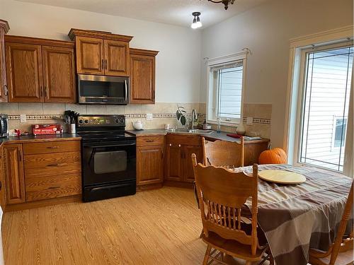 226 Harvest Hills Boulevard, Stavely, AB - Indoor Photo Showing Kitchen With Double Sink