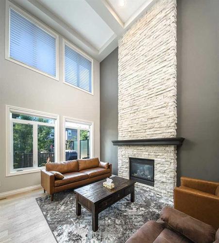 35 Aspen Summit Mount Sw, Calgary, AB - Indoor Photo Showing Living Room With Fireplace