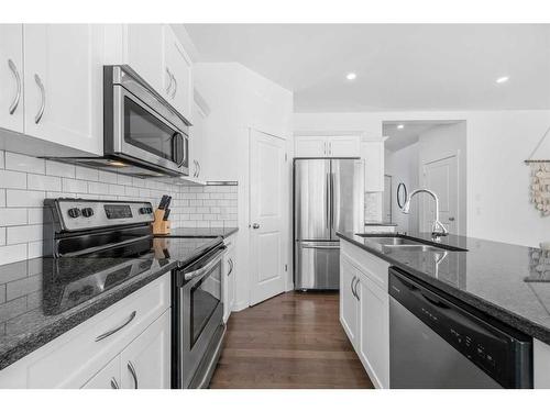 277 Willow Park, Cochrane, AB - Indoor Photo Showing Kitchen With Double Sink With Upgraded Kitchen