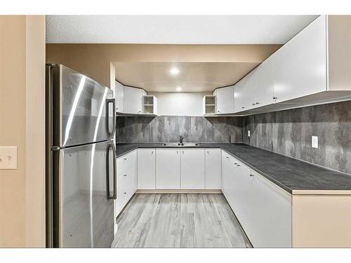 448 Ogden Drive Se, Calgary, AB - Indoor Photo Showing Kitchen With Double Sink