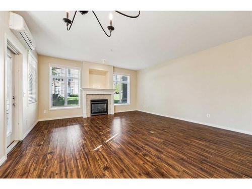 3104 Lake Fraser Court Se, Calgary, AB - Indoor Photo Showing Living Room With Fireplace