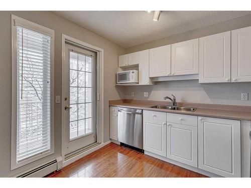 3216-3216 Sienna Park Green Sw, Calgary, AB - Indoor Photo Showing Kitchen With Double Sink