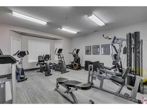 3216-3216 Sienna Park Green Sw, Calgary, AB - Indoor Photo Showing Gym Room