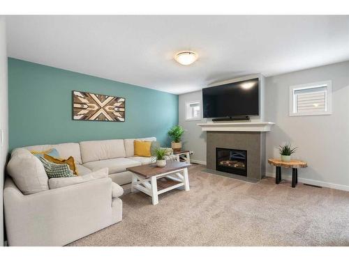 71 Ravenstern Point Se, Airdrie, AB - Indoor Photo Showing Living Room With Fireplace