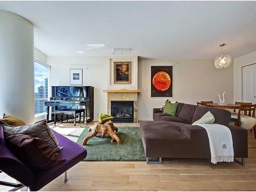 904-1088 6 Avenue Sw, Calgary, AB - Indoor Photo Showing Living Room With Fireplace