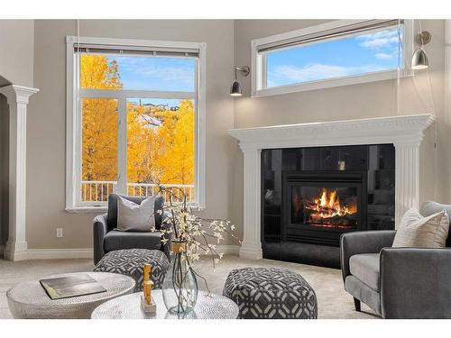 74 Patterson Close Sw, Calgary, AB - Indoor Photo Showing Living Room With Fireplace