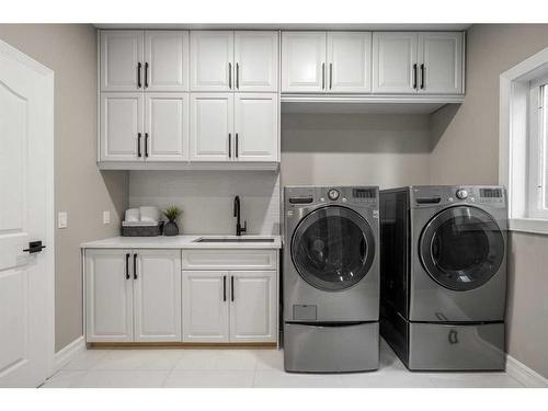 74 Patterson Close Sw, Calgary, AB - Indoor Photo Showing Laundry Room