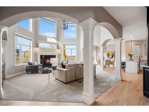 74 Patterson Close Sw, Calgary, AB - Indoor Photo Showing Living Room With Fireplace