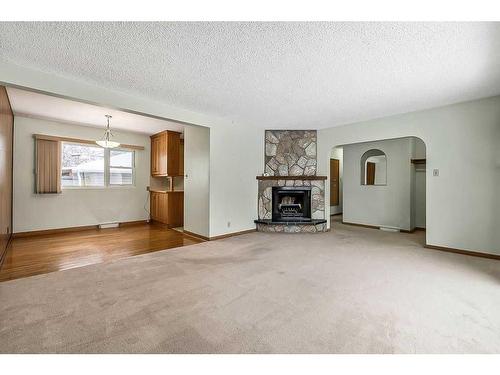 3807 25 Avenue Sw, Calgary, AB - Indoor Photo Showing Living Room With Fireplace