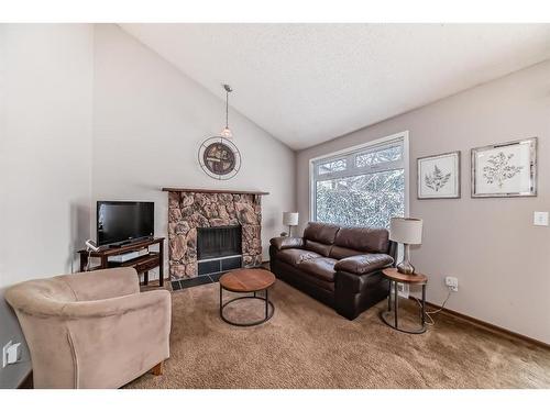 35 Templegreen Place Ne, Calgary, AB - Indoor Photo Showing Living Room With Fireplace