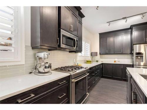 211 Valley Ridge Manor Nw, Calgary, AB - Indoor Photo Showing Kitchen With Double Sink With Upgraded Kitchen