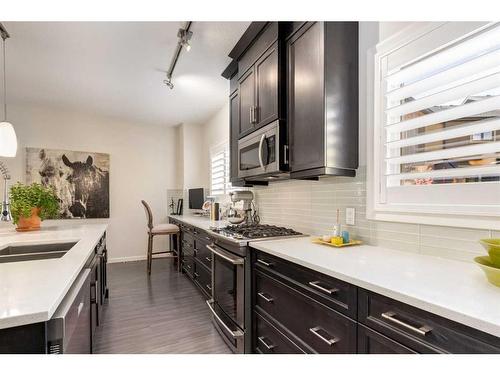 211 Valley Ridge Manor Nw, Calgary, AB - Indoor Photo Showing Kitchen With Double Sink With Upgraded Kitchen