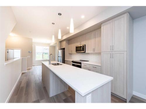 1023 Sage Hill Grove Nw, Calgary, AB - Indoor Photo Showing Kitchen With Double Sink With Upgraded Kitchen