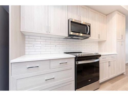 1023 Sage Hill Grove Nw, Calgary, AB - Indoor Photo Showing Kitchen With Upgraded Kitchen