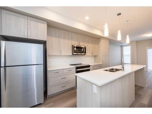 1023 Sage Hill Grove Nw, Calgary, AB - Indoor Photo Showing Kitchen With Double Sink With Upgraded Kitchen