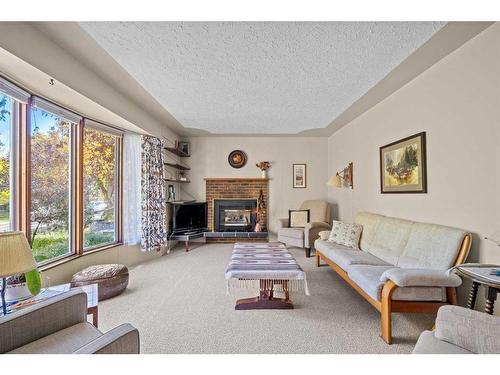 1221 20A Street Nw, Calgary, AB - Indoor Photo Showing Living Room With Fireplace