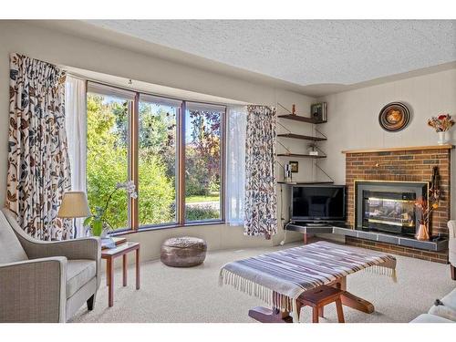 1221 20A Street Nw, Calgary, AB - Indoor Photo Showing Living Room With Fireplace