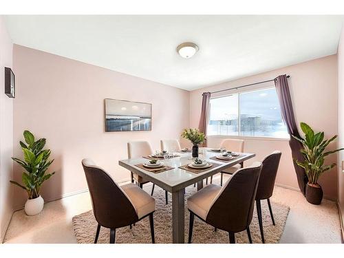 7-73 Glenbrook Crescent, Cochrane, AB - Indoor Photo Showing Dining Room