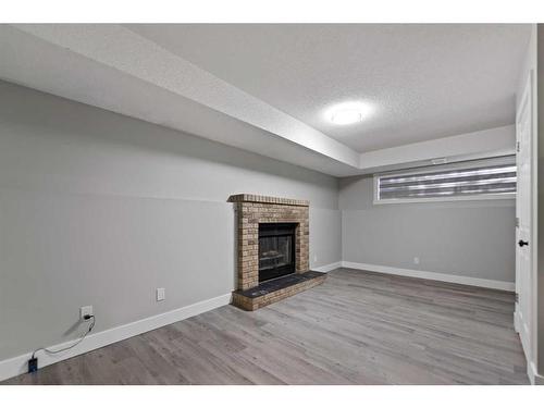 95 Laguna Circle Ne, Calgary, AB - Indoor With Fireplace