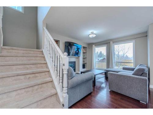 155 Willowbrook Drive Nw, Airdrie, AB - Indoor Photo Showing Living Room With Fireplace