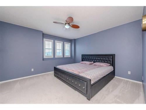 155 Willowbrook Drive Nw, Airdrie, AB - Indoor Photo Showing Bedroom