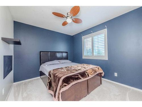 155 Willowbrook Drive Nw, Airdrie, AB - Indoor Photo Showing Bedroom