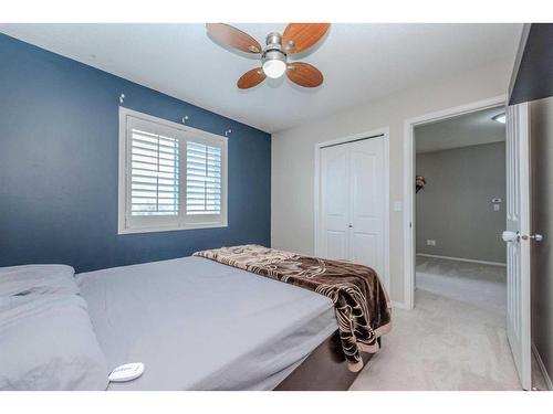 155 Willowbrook Drive Nw, Airdrie, AB - Indoor Photo Showing Bedroom