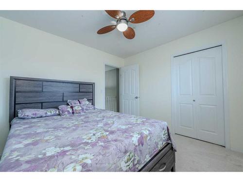 155 Willowbrook Drive Nw, Airdrie, AB - Indoor Photo Showing Bedroom