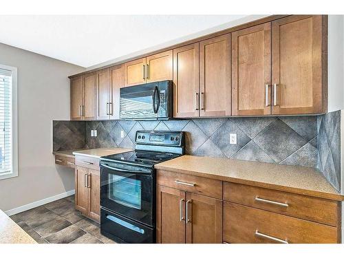 14 Silverado Saddle Heights Sw, Calgary, AB - Indoor Photo Showing Kitchen