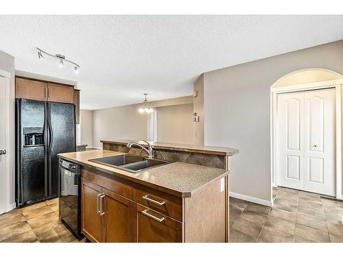 14 Silverado Saddle Heights Sw, Calgary, AB - Indoor Photo Showing Kitchen With Double Sink