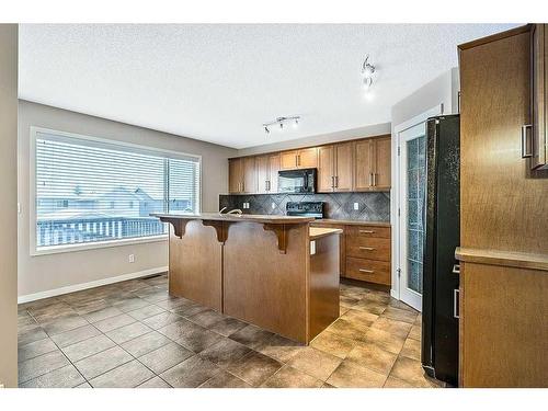 14 Silverado Saddle Heights Sw, Calgary, AB - Indoor Photo Showing Kitchen