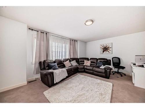 141 Cranston Way Se, Calgary, AB - Indoor Photo Showing Living Room