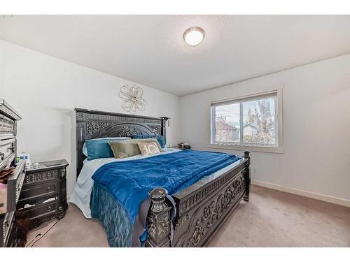 141 Cranston Way Se, Calgary, AB - Indoor Photo Showing Bedroom