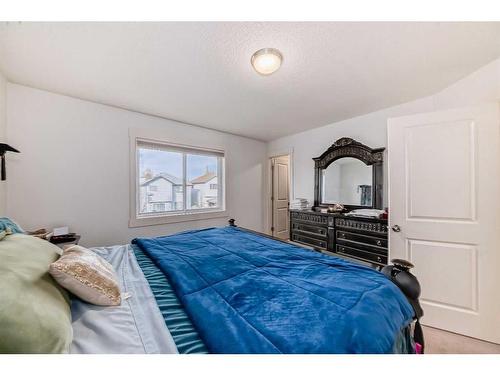 141 Cranston Way Se, Calgary, AB - Indoor Photo Showing Bedroom