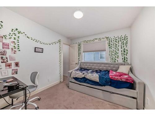 141 Cranston Way Se, Calgary, AB - Indoor Photo Showing Bedroom