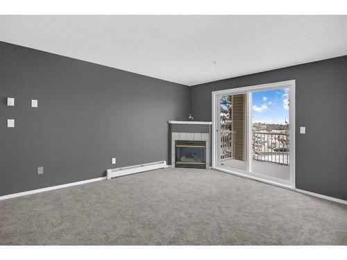 335-1717 60 Street Se, Calgary, AB - Indoor With Fireplace