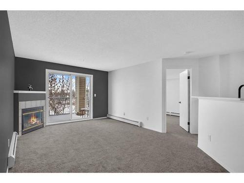 335-1717 60 Street Se, Calgary, AB - Indoor With Fireplace