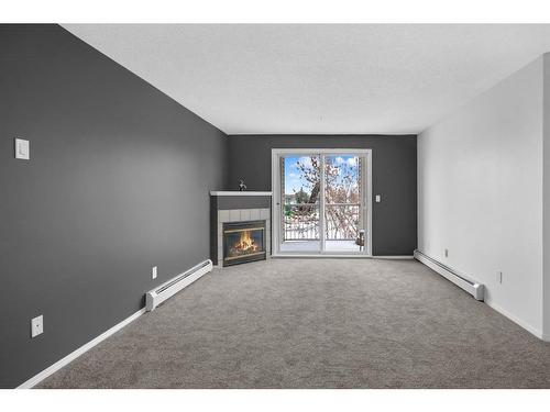 335-1717 60 Street Se, Calgary, AB - Indoor With Fireplace