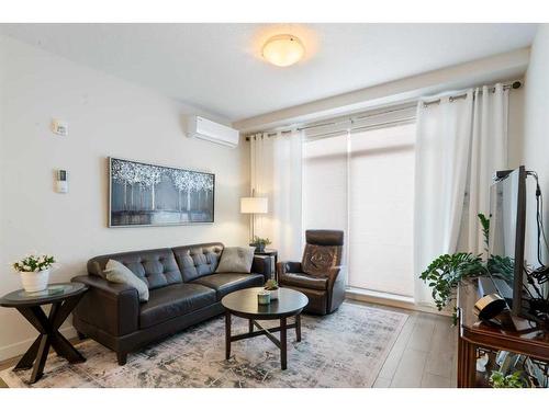 4308-522 Cranford Drive Se, Calgary, AB - Indoor Photo Showing Living Room