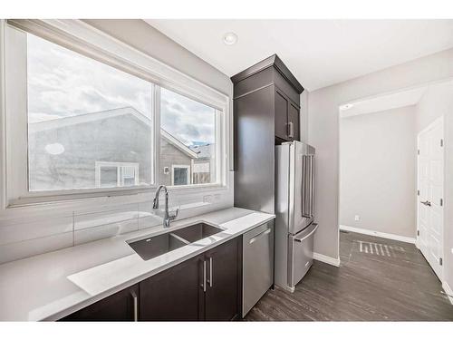 151 Masters Link Se, Calgary, AB - Indoor Photo Showing Kitchen With Stainless Steel Kitchen With Double Sink