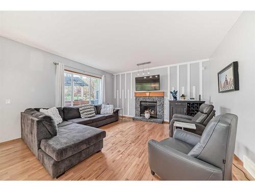 159 Crystal Shores Drive, Okotoks, AB - Indoor Photo Showing Living Room With Fireplace