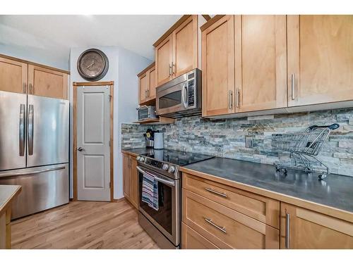 159 Crystal Shores Drive, Okotoks, AB - Indoor Photo Showing Kitchen With Stainless Steel Kitchen