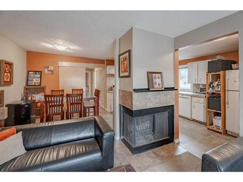 7002 54 Avenue Nw, Calgary, AB - Indoor Photo Showing Living Room With Fireplace