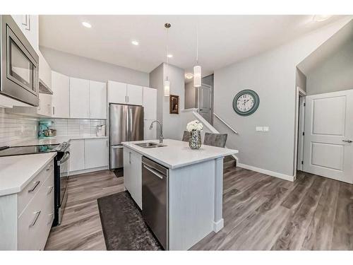 204 Crestbrook Common Sw, Calgary, AB - Indoor Photo Showing Kitchen With Stainless Steel Kitchen With Double Sink With Upgraded Kitchen