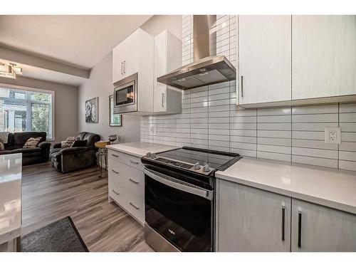 204 Crestbrook Common Sw, Calgary, AB - Indoor Photo Showing Kitchen With Upgraded Kitchen