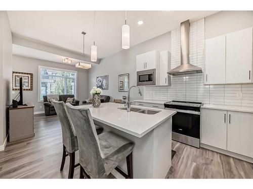 204 Crestbrook Common Sw, Calgary, AB - Indoor Photo Showing Kitchen With Double Sink With Upgraded Kitchen