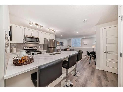 509-474 Seton Circle Se, Calgary, AB - Indoor Photo Showing Kitchen With Stainless Steel Kitchen With Double Sink With Upgraded Kitchen