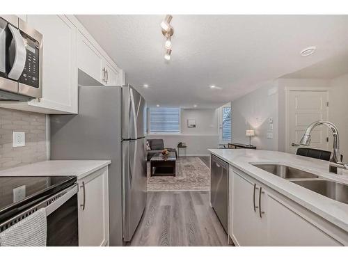 509-474 Seton Circle Se, Calgary, AB - Indoor Photo Showing Kitchen With Double Sink