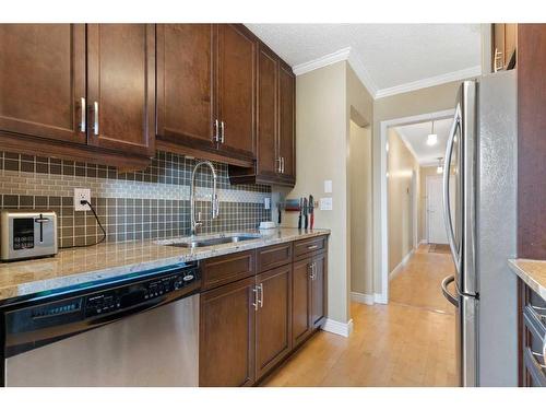 301-1721 13 Street Sw, Calgary, AB - Indoor Photo Showing Kitchen With Stainless Steel Kitchen With Double Sink